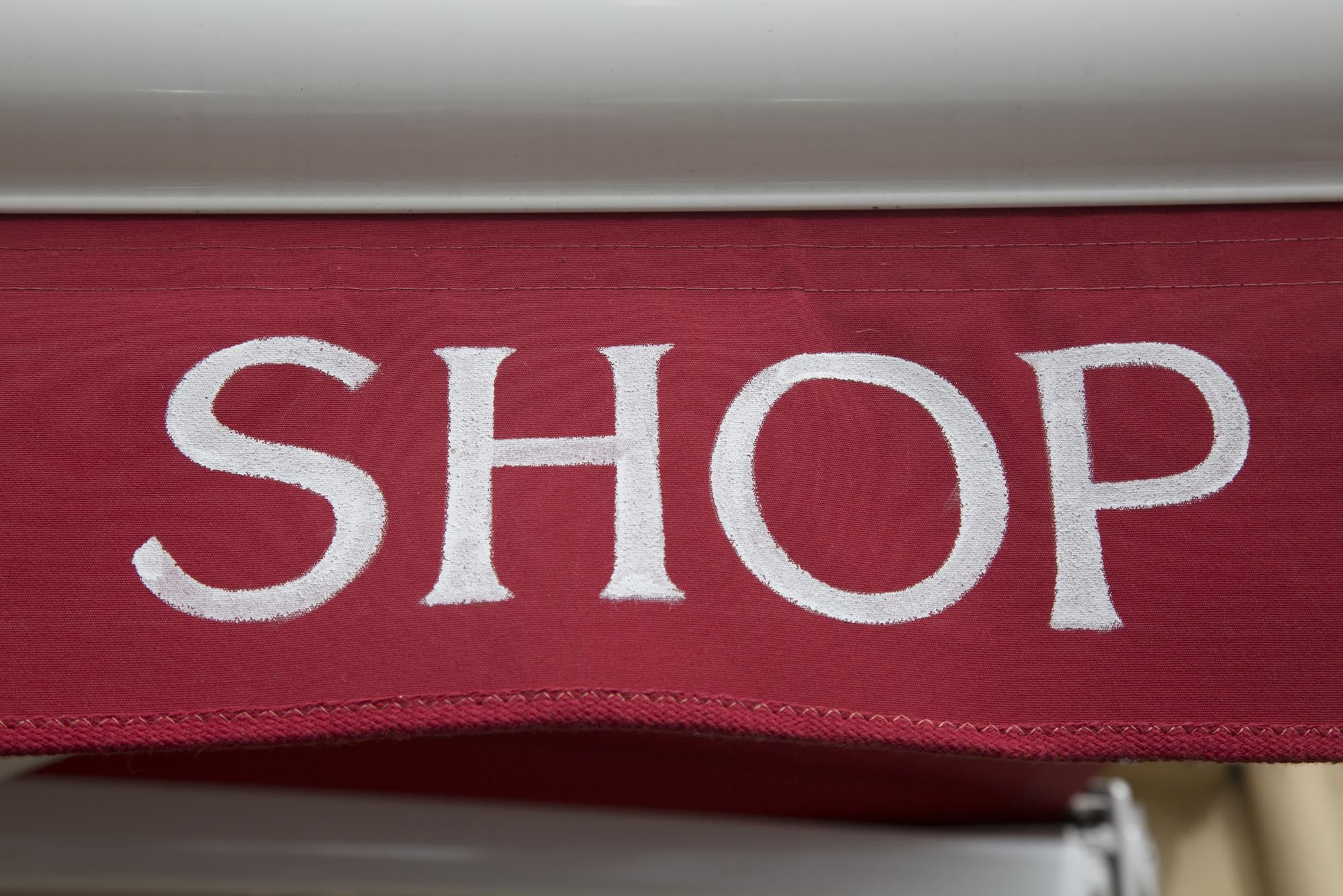 studio storefront with embroidery sign